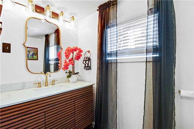 bathroom with a healthy amount of sunlight and vanity