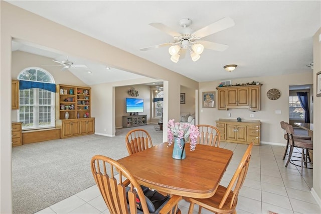 11319 Easley Dr, Lees Summit, MO 64086 - dining room featuring light tile patterned flooring, ceiling fan, lofted ceiling, and baseboards