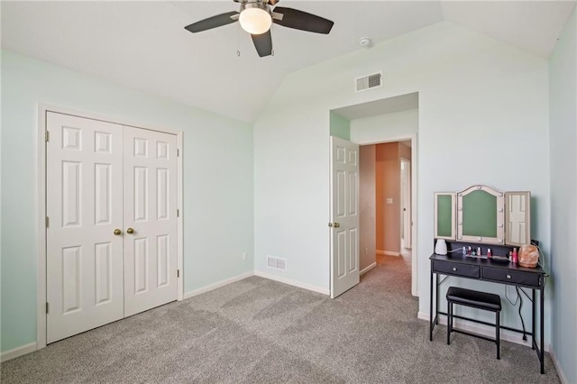 bedroom with lofted ceiling, carpet flooring, visible vents, and baseboards