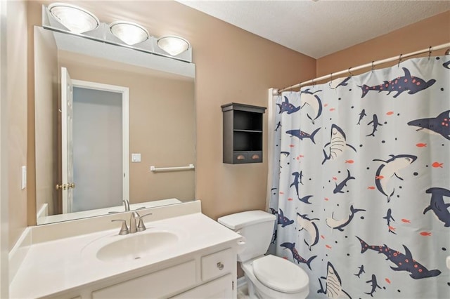 bathroom featuring toilet, vanity, and a shower with shower curtain