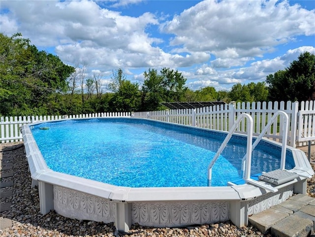 11319 Easley Dr, Lees Summit, MO 64086 - view of pool featuring fence and view of wooded area