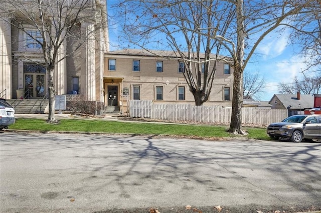 314 N 6th St, Leavenworth, KS 66048 - multi unit property with a fenced front yard and brick siding