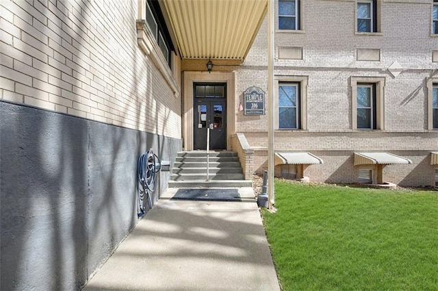 314 N 6th St, Leavenworth, KS 66048 - property entrance with a lawn and brick siding