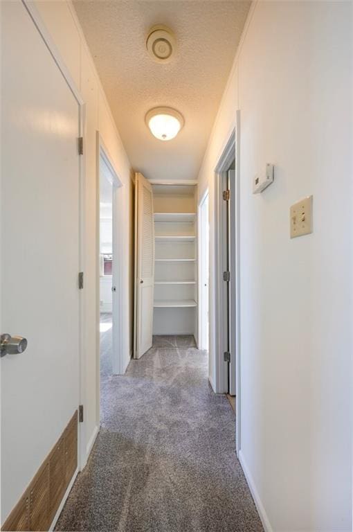 314 N 6th St, Leavenworth, KS 66048 - hall with light carpet, a textured ceiling, visible vents, and baseboards