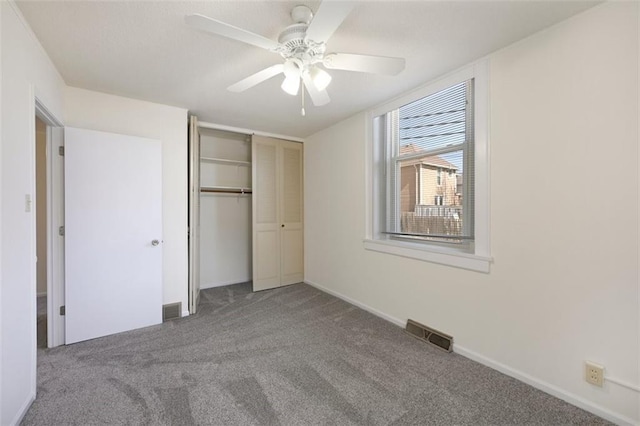 314 N 6th St, Leavenworth, KS 66048 - unfurnished bedroom featuring carpet, a closet, visible vents, and ceiling fan