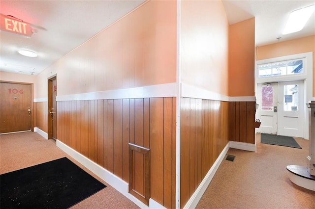 314 N 6th St, Leavenworth, KS 66048 - hallway featuring a wainscoted wall, carpet flooring, and visible vents