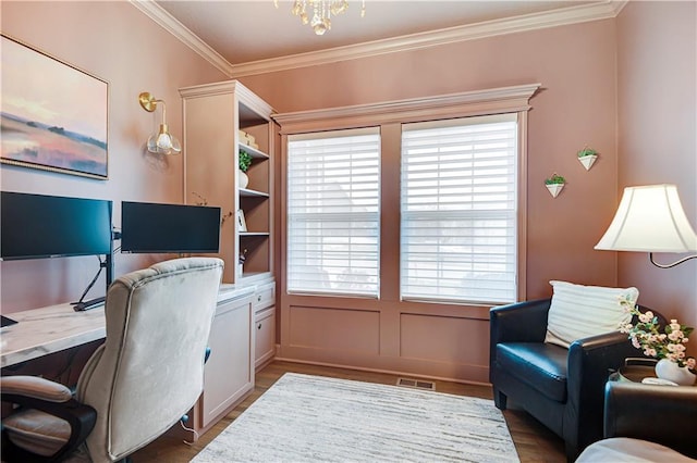 office area featuring crown molding, wood finished floors, and visible vents