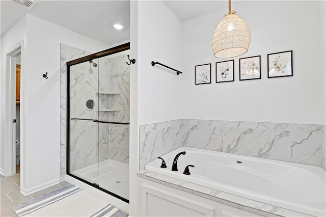 bathroom with a garden tub, toilet, visible vents, and a marble finish shower