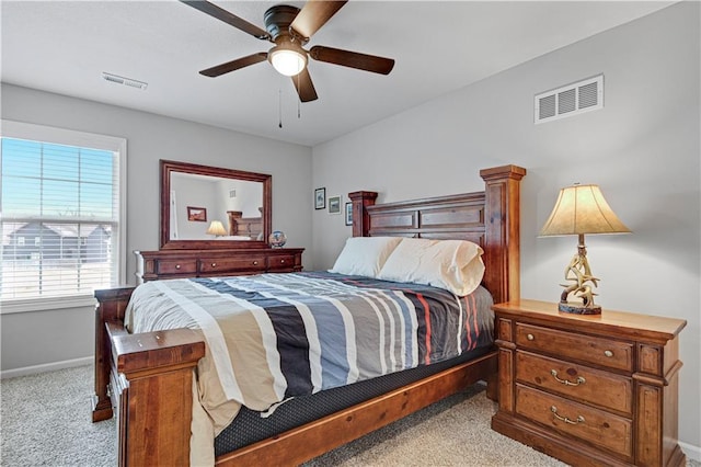 bedroom with visible vents, ceiling fan, baseboards, and carpet