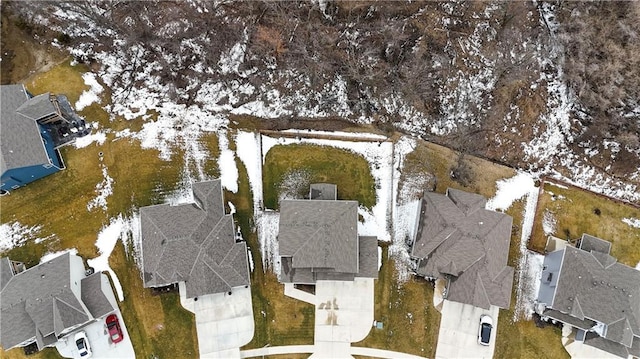 snowy aerial view with a residential view