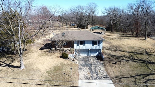 view of front of property featuring a garage, driveway, and board and batten siding