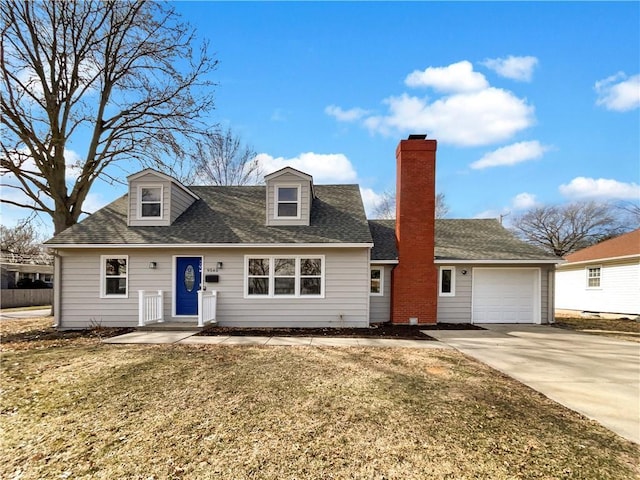 cape cod home with a garage, concrete driveway, roof with shingles, a front lawn, and a chimney