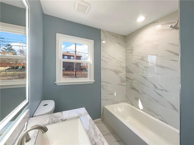 bathroom featuring visible vents, toilet, marble finish floor, bathtub / shower combination, and recessed lighting