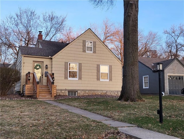 bungalow with a front lawn, a chimney, and a shingled roof