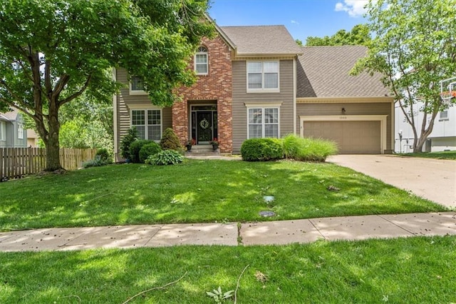 13012 Ballentine St, Overland Park, KS 66213 - view of front facade featuring an attached garage and driveway