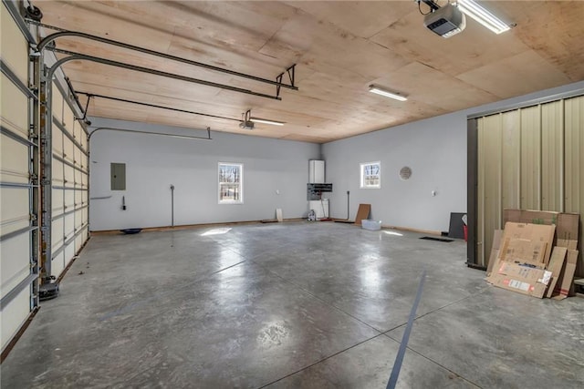 garage with electric panel and a garage door opener