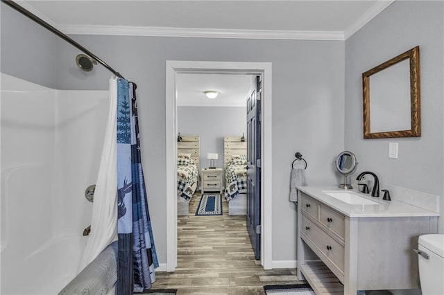 full bath with crown molding, toilet, ensuite bathroom, shower / bath combo, and wood finished floors