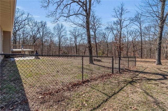 view of yard with fence and a deck