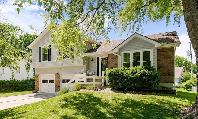 15905 W 152nd Ter, Olathe, KS 66062 - split level home featuring brick siding, concrete driveway, and a front yard
