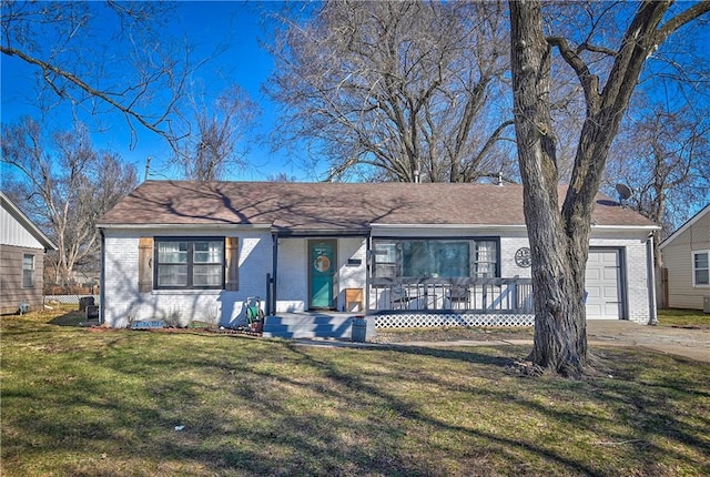 single story home with brick siding, a front lawn, a porch, concrete driveway, and a garage