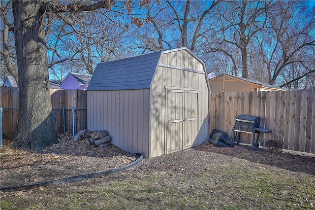 view of shed with a fenced backyard