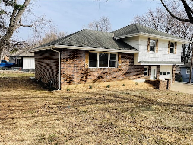 view of home's exterior featuring driveway, brick siding, a garage, and roof with shingles