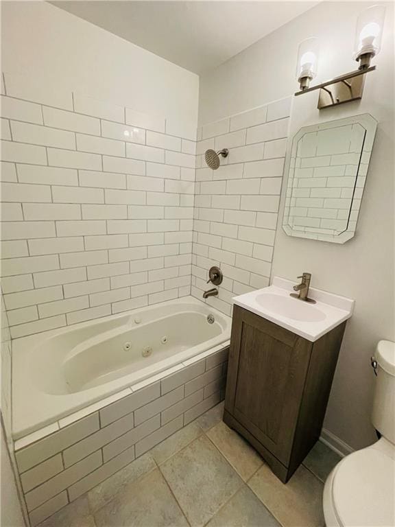 full bath with tile patterned floors, toilet, vanity, and a combined bath / shower with jetted tub