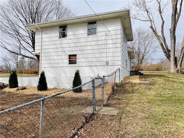 view of home's exterior featuring fence