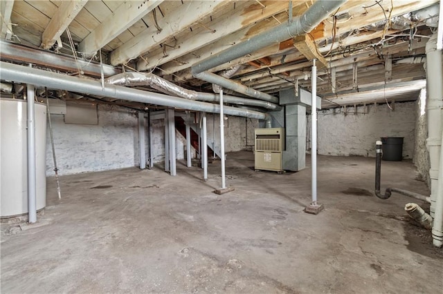 unfinished basement featuring water heater