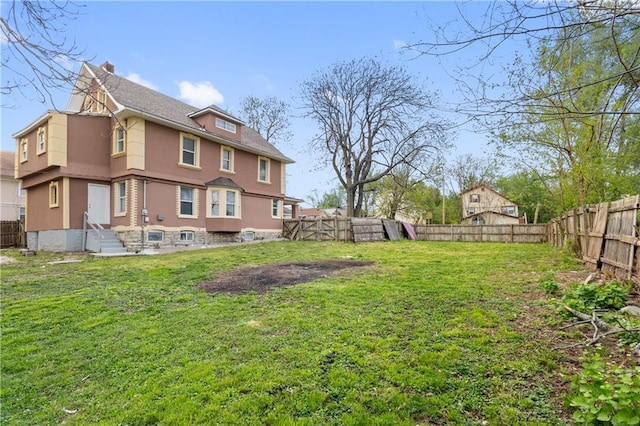 view of yard with a fenced backyard