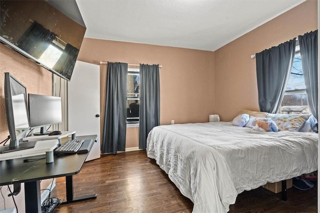 bedroom with wood finished floors