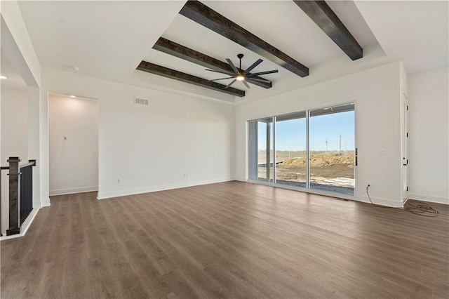 unfurnished living room featuring ceiling fan, beamed ceiling, baseboards, and wood finished floors