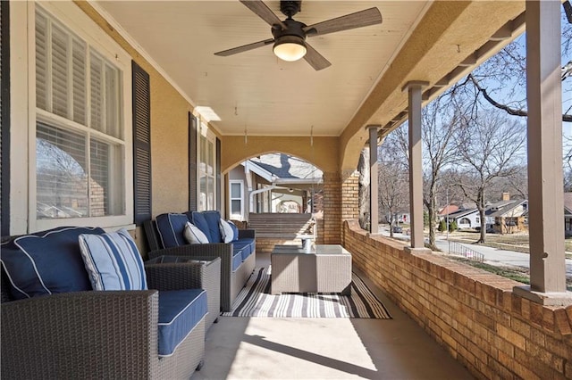 view of patio with outdoor lounge area and a ceiling fan