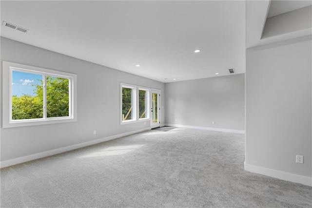 carpeted spare room with recessed lighting, visible vents, and baseboards