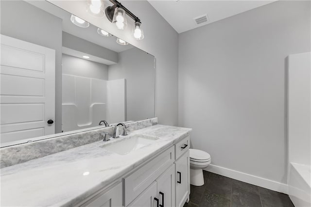 bathroom with visible vents, toilet, vanity, baseboards, and walk in shower