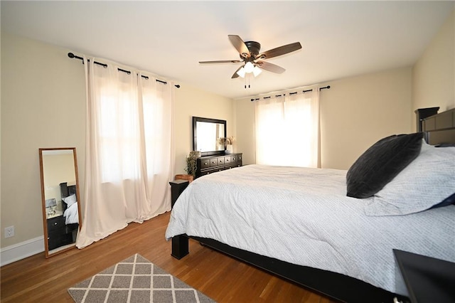 bedroom featuring ceiling fan and wood finished floors