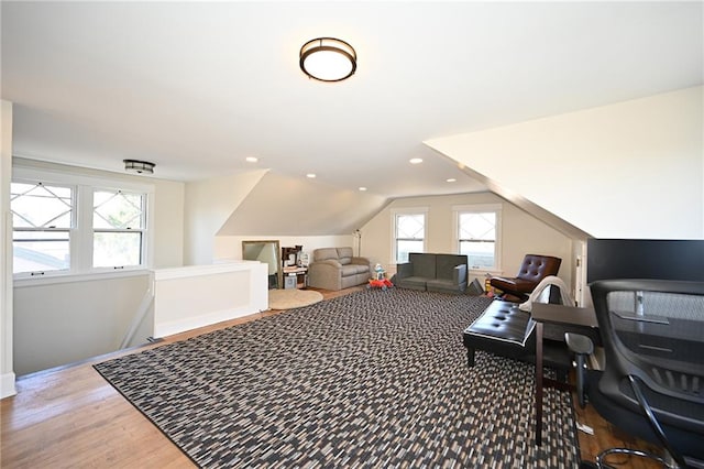 bonus room with recessed lighting, lofted ceiling, and wood finished floors