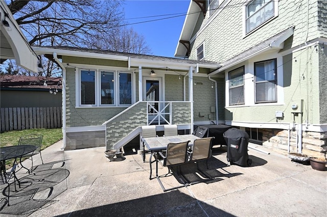 view of patio / terrace with outdoor dining space and fence