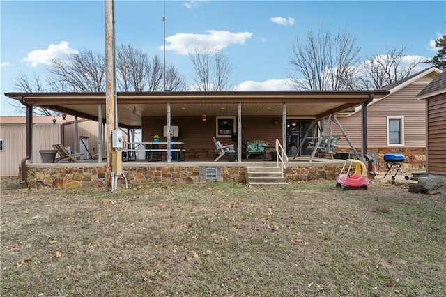 rear view of property featuring a patio