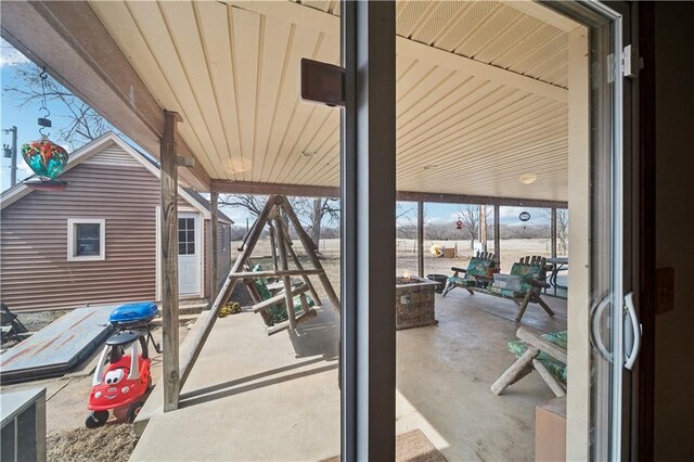 view of patio featuring an outdoor fire pit