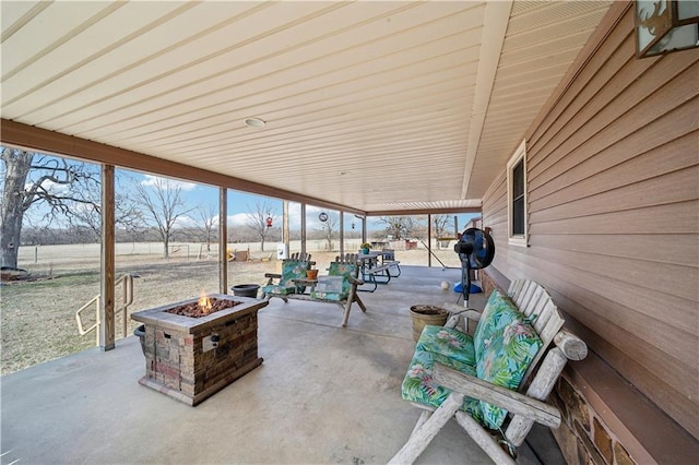 view of patio featuring an outdoor fire pit