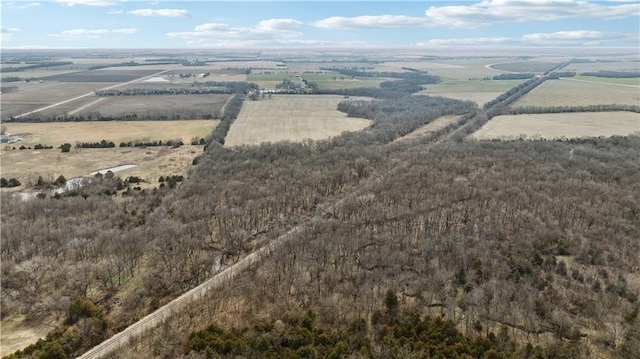 birds eye view of property with a rural view