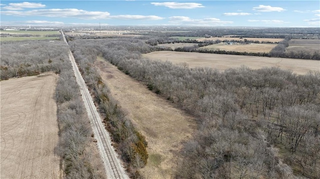 birds eye view of property with a rural view