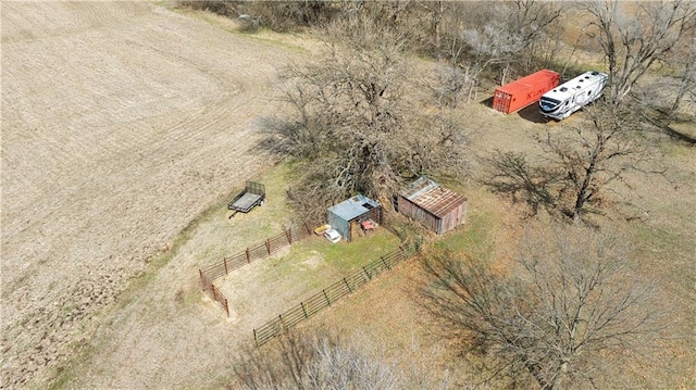 birds eye view of property with a rural view