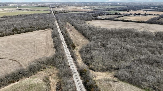 birds eye view of property with a rural view