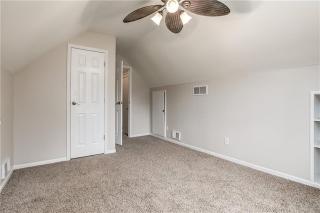 bonus room with lofted ceiling, ceiling fan, visible vents, baseboards, and carpet