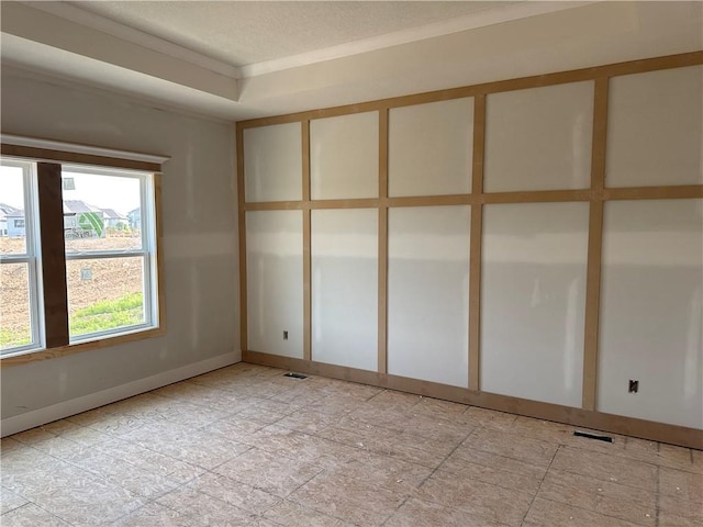 4524 N 86th Ter, Kansas City, MO 64156 - unfurnished room featuring crown molding, baseboards, and a textured ceiling