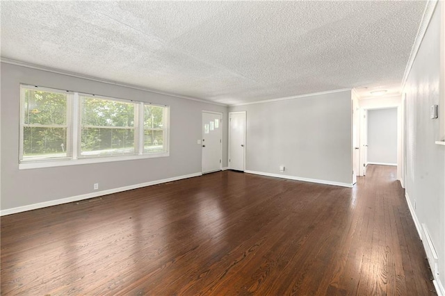 unfurnished living room with baseboards, dark wood-type flooring, ornamental molding, and a textured ceiling