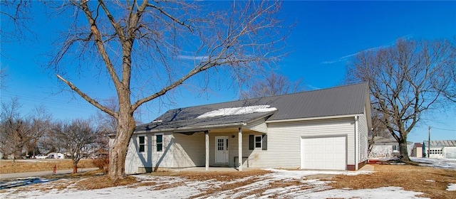 view of front of house with a porch and metal roof