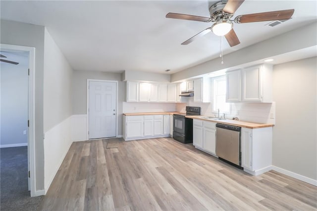 kitchen with under cabinet range hood, black / electric stove, white cabinets, and stainless steel dishwasher